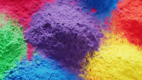 Video-of-close-up-of-multi-coloured-powders-with-copy-space