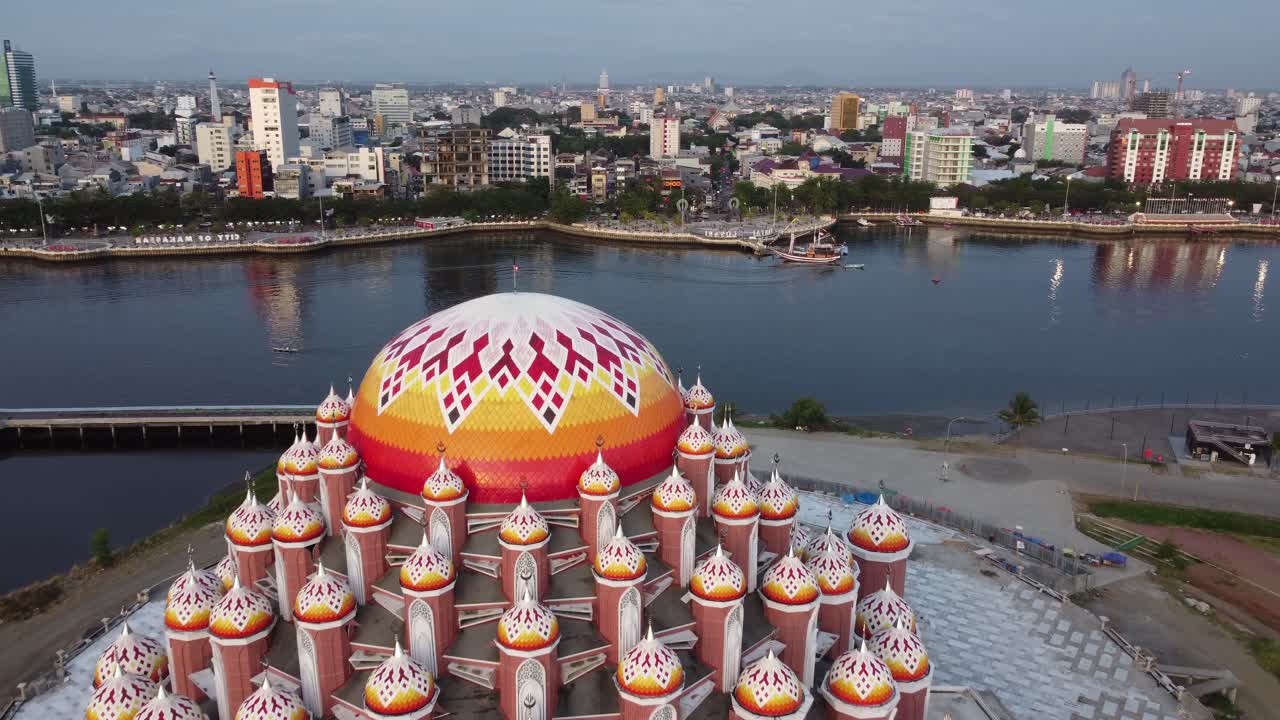 Aerial View of the Iconic 99 Domes Mosque in Makassar with City Skyline and Waterfront