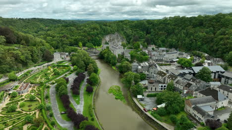 Drone-view-over-Ourthe-river-and-Topiary-Park-in-Durbuy,-Wallonia,-Belgium