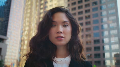 portrait of beautiful asian model close up. attractive woman posing on street.