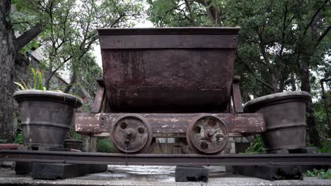 metal rail wagon in the middle of two pots