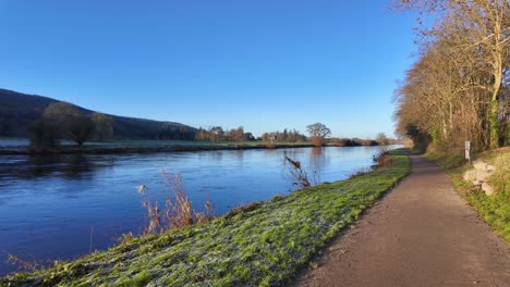 cycleway on the river suir at kilsheelan tipperary ireland with strong water flow