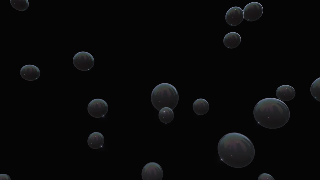 Bolle di sapone trasparenti e iridescenti fluttuano orizzontalmente su uno sfondo nero con un movimento delicato.