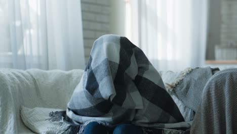 woman covered with blanket