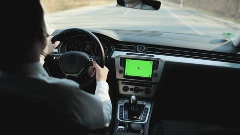 footage for animation. cyber space technology. adult man driving nano auto car with greenscreen mock-up display dashboard service menu application. automobile wifi internet connect. transport app