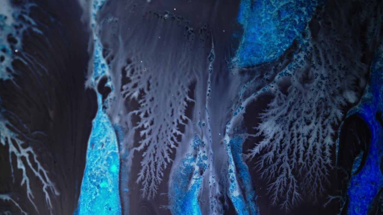 Lush abstract ink swirling with vibrant blue tones and delicate organic patterns