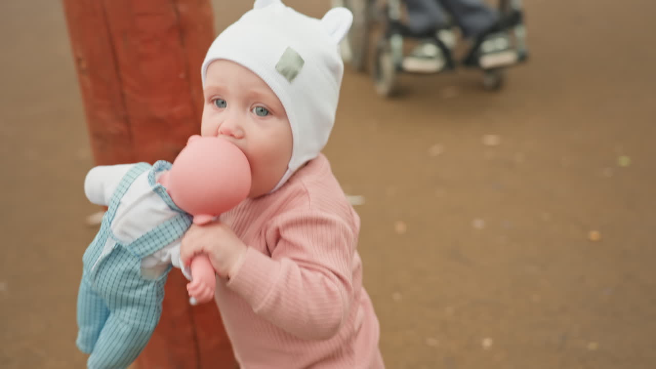 Joyful Family Outing, Family Enjoying Accessible Playground Together, Woman And Child Sharing Happy Moments Outdoors, Family Engaging In Playful Activities With Inclusive Environment