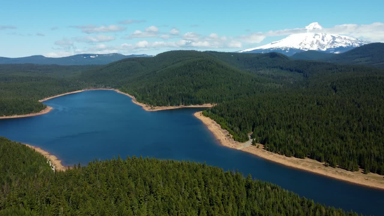 US, Oregon, Mt Hood, Clear Lake, 2025-04-22 - Drone view of Mt Hood at Clear Lake. On a spring day, with some clouds, viewed from the Southeast.