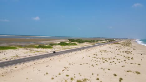 picturesque aerial drone shot of dhanushkodi’s isolated beauty and historic ruins along the coastline.