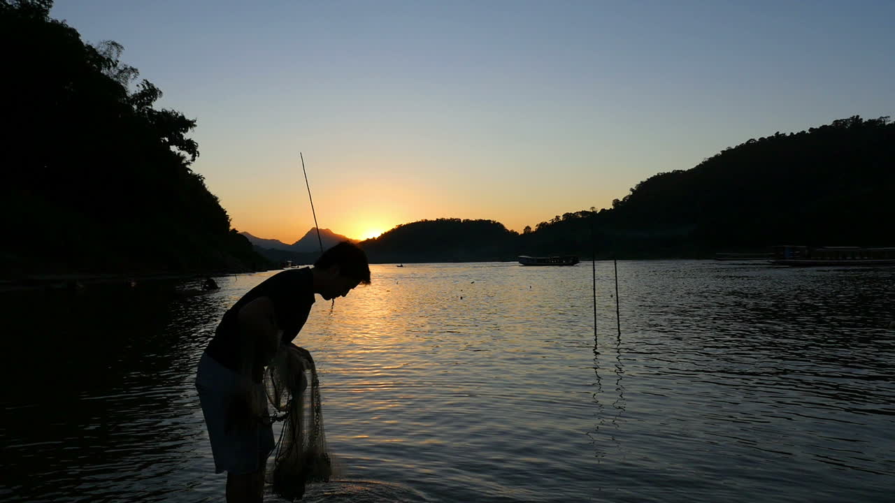Fisherman at Sunset on the River