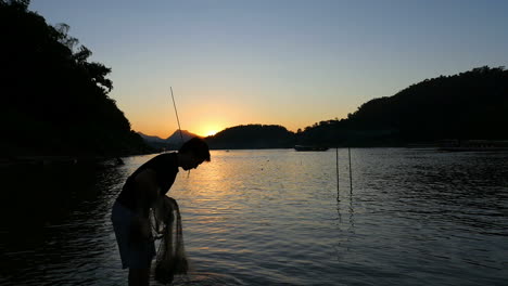 fisherman at sunset on the river