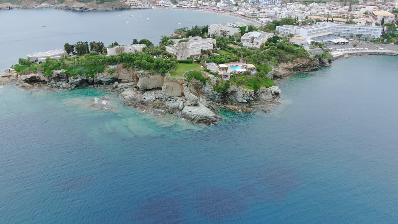 Aerial flying over luxury resorts in Agia Pelagia, a beautiful village in Crete Island