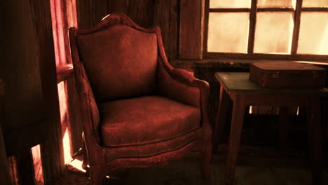 vintage red armchair in a rustic cabin