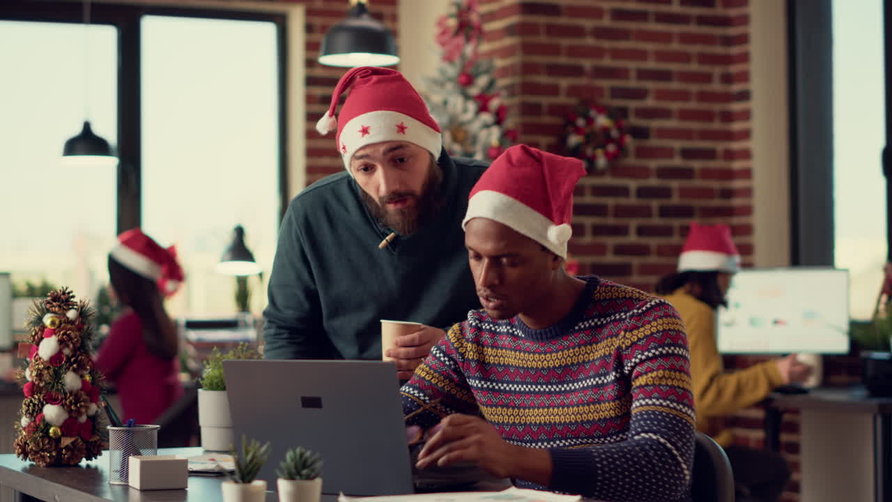 Multiethnic team of people analyzing report on computer