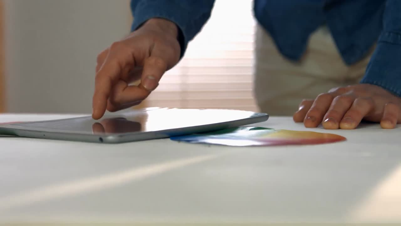 Male graphic designer using digital tablet