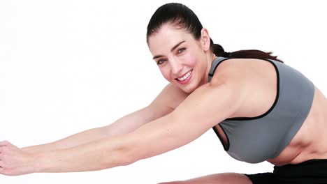 smiling athlete stretching legs