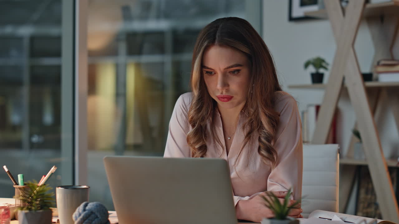 Stressed businesswoman talking cellphone holding documents in office closeup