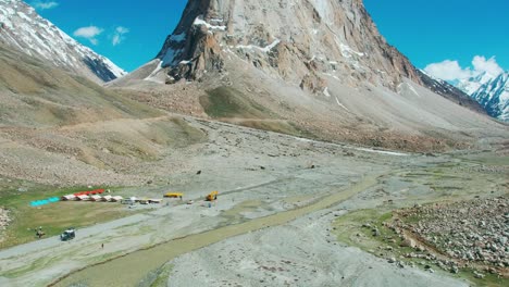 aerial drone footage of snow covered mountains at everest base camp in nepal, highlighting the majestic himalayan peaks, and rugged terrain during daytime