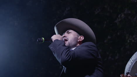 close-up of a charismatic mariachi singer captivating the audience with their vibrant performance in a lively club