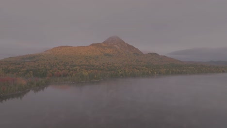 Borestone-mountain-aerial-ascending-into-the-thick-cloud-cover-Transitional-Aerial-Shot