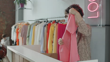 Young-Black-Woman-Buying-New-Outfit-in-Clothes-Shop