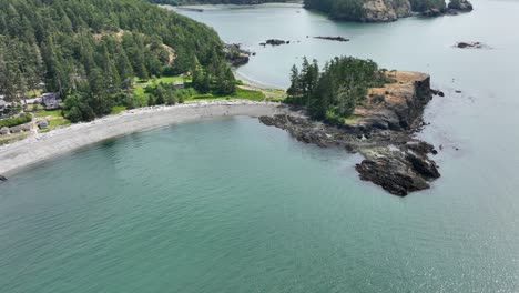 Wide-drone-shot-of-Rosario-Beach-and-its-expansive-waters-of-Washington's-coast