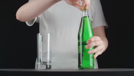 video of young woman pouring green lemonade