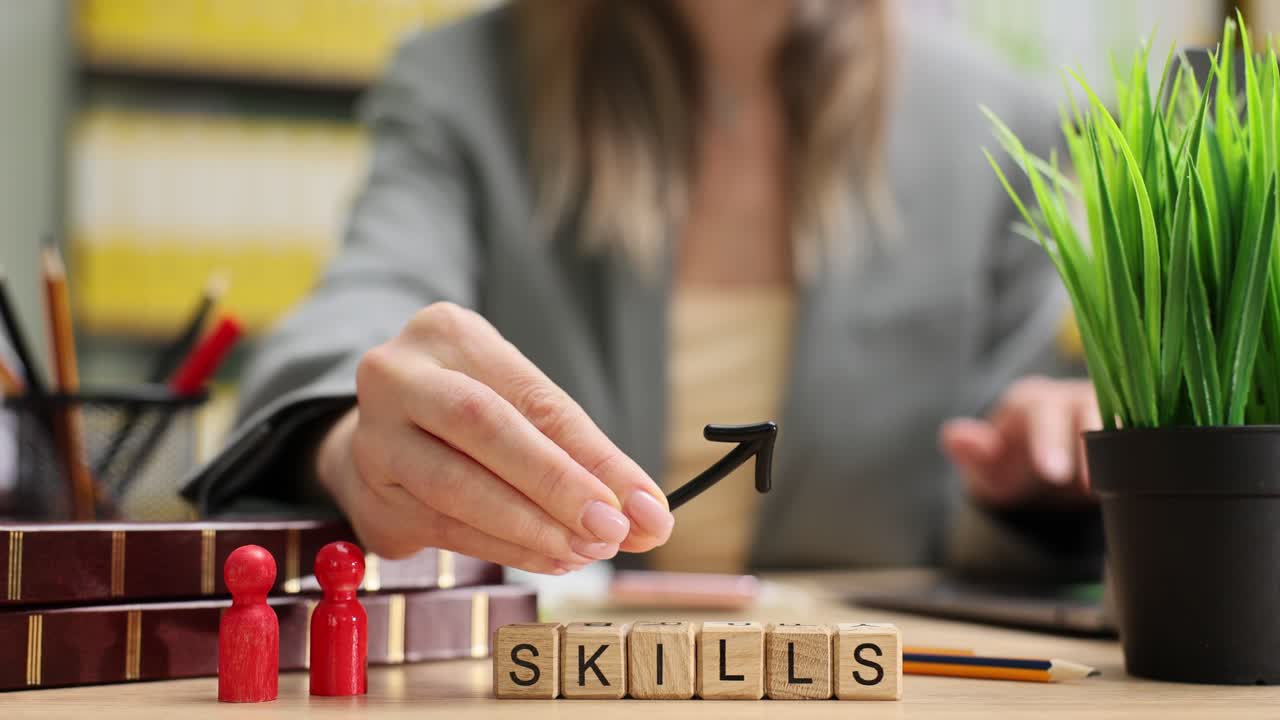 Miniature wooden cubes on table create word skills near figurines