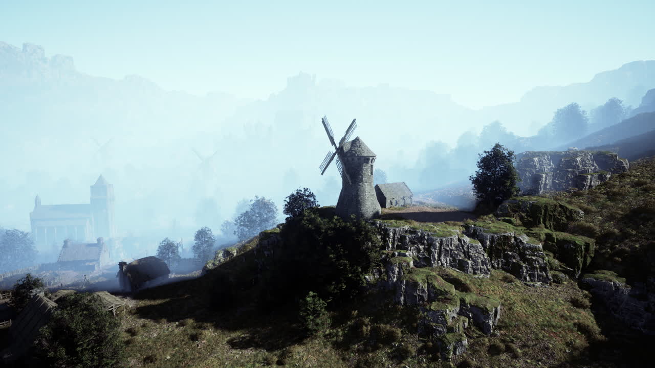 풍차 가 있는 안개 가 가득 한 산 마을