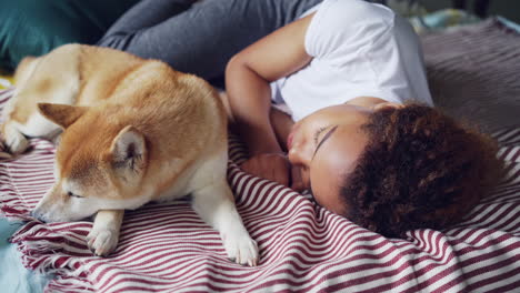 woman and dog sleeping together