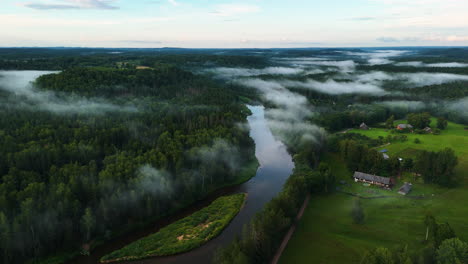awe inspiring aerial shot of gauja national park in sigulda, latvia. drone capturing the gauja river, valley, and forest landscape.