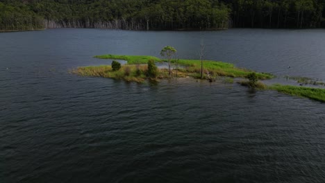 circular aerial views of a small island on advancetown lake near the western boat ramp on the gold coast hinterland.