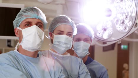 surgical team looking at the camera in operating theater