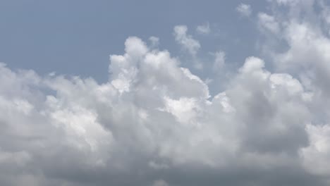 timelapse of blue sky with fast moving white fluffy cloud, fluffy white cloud rising