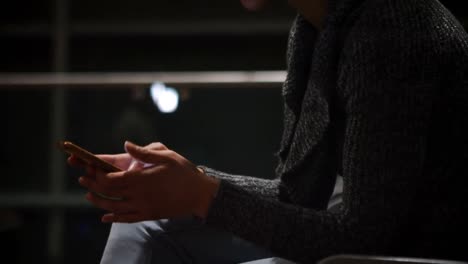 commuters using mobile phone in waiting area 4k