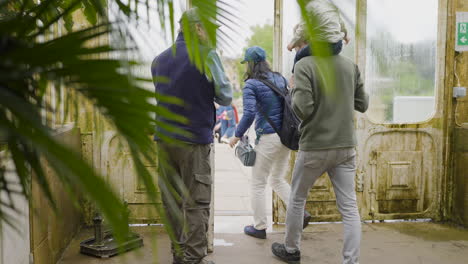 family visiting a greenhouse