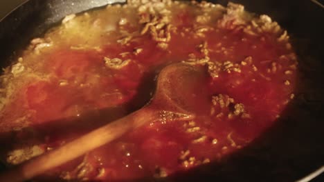 tomato-based sauce with minced meat in a pan