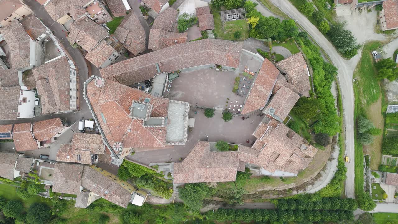 Barolo Castle in Langhe Wine Region, Cuneo, Piedmont, Italy. 4kAerial view top down zenital descending, castle on the left