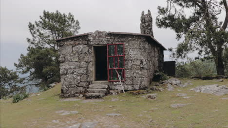 approaching abandonded cabin in the mountains from point of view