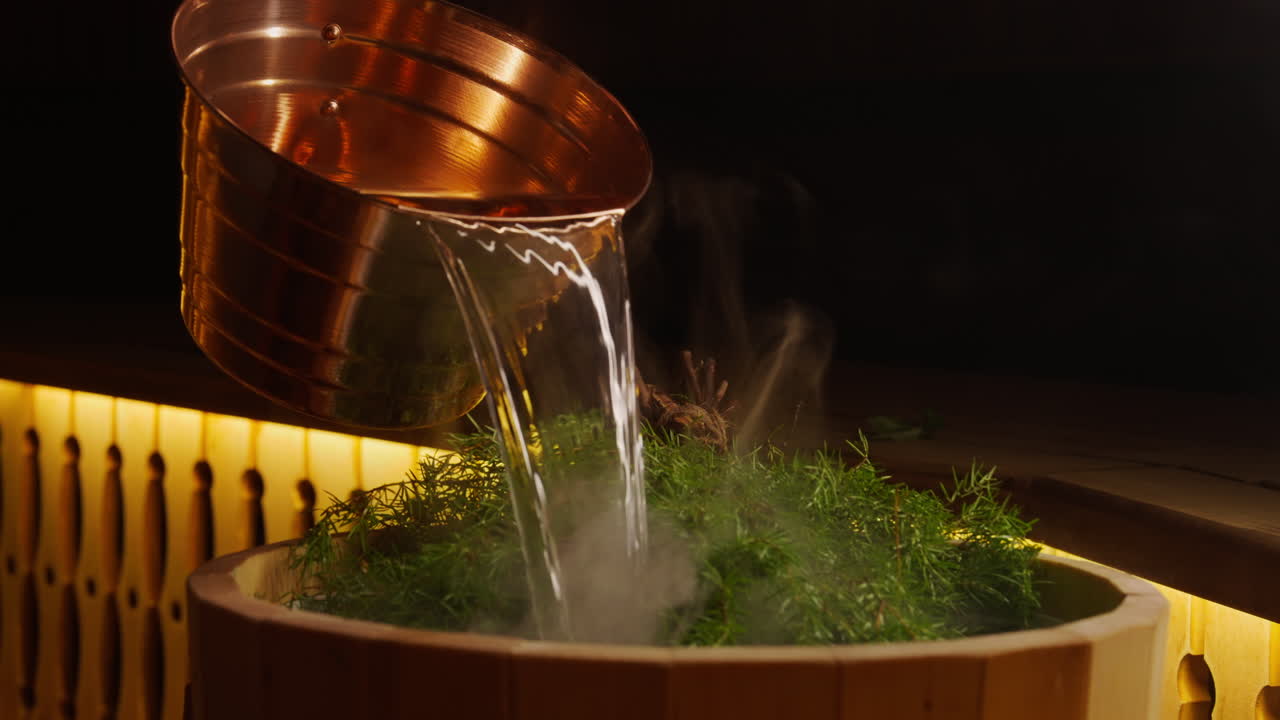 Preparing a traditional sauna with herbs and copper pot
