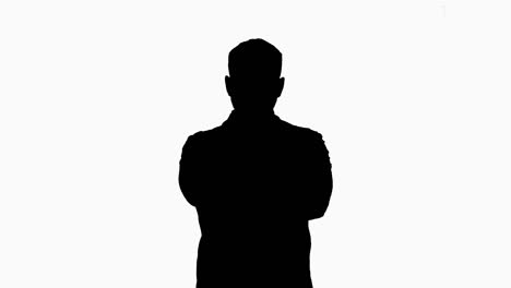 silhouette young male caucasian doctor standing with folded hands