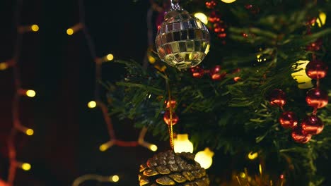 track past decorations and lights hanging on christmas tree