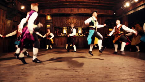 dynamic folk dance performance by a group in traditional costumes