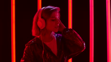 woman with headphones in neon light