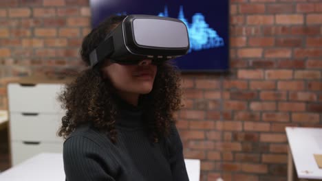 creative businesswoman using virtual reality headset in modern office