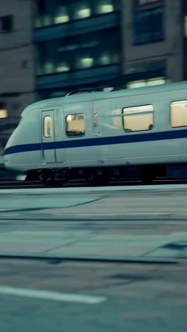 close-up of an eye and a train at night in a city