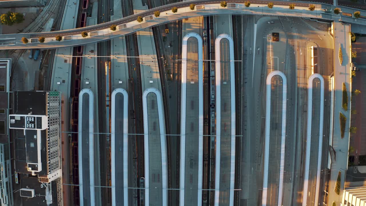 Vertical aerial view over deserted highways and roads around central train station of Utrecht city during lockdown for containment of Corona virus, Netherlands