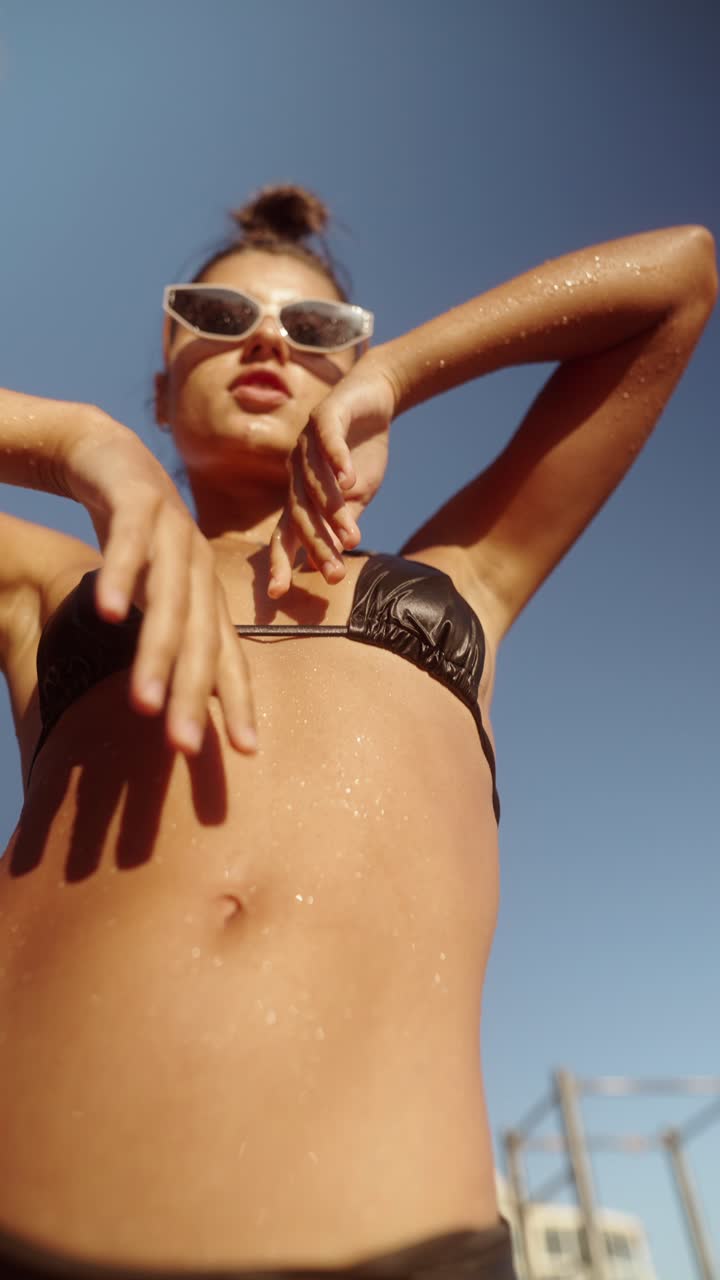 Woman in bikini enjoying the summer sun