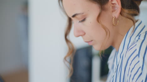 Woman-Texting-at-Desk