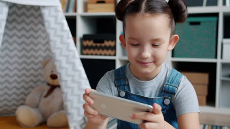 girl playing on smartphone